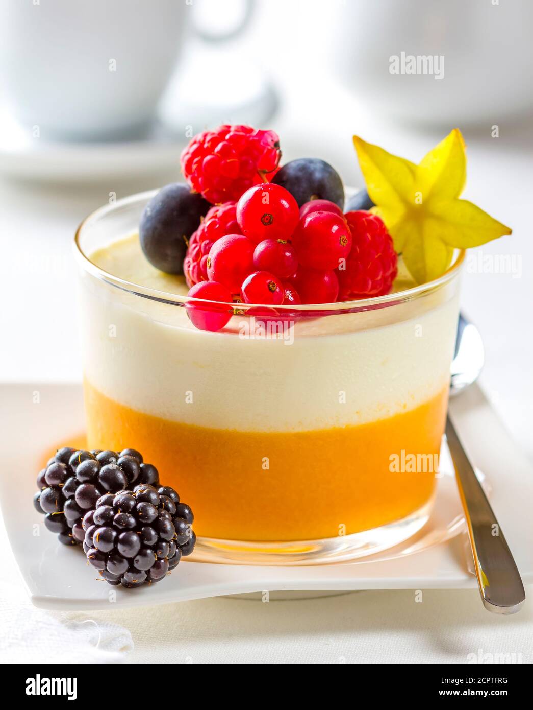 Cheesecake mousse dessert served with fruit in a glass. Stock Photo