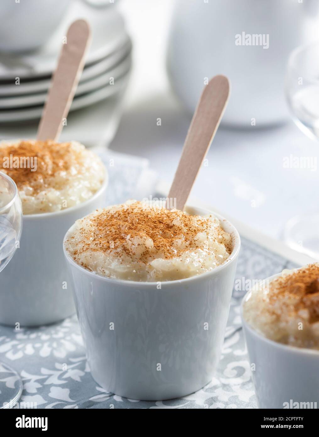 Bowls of rice pudding served with cinnamon Stock Photo