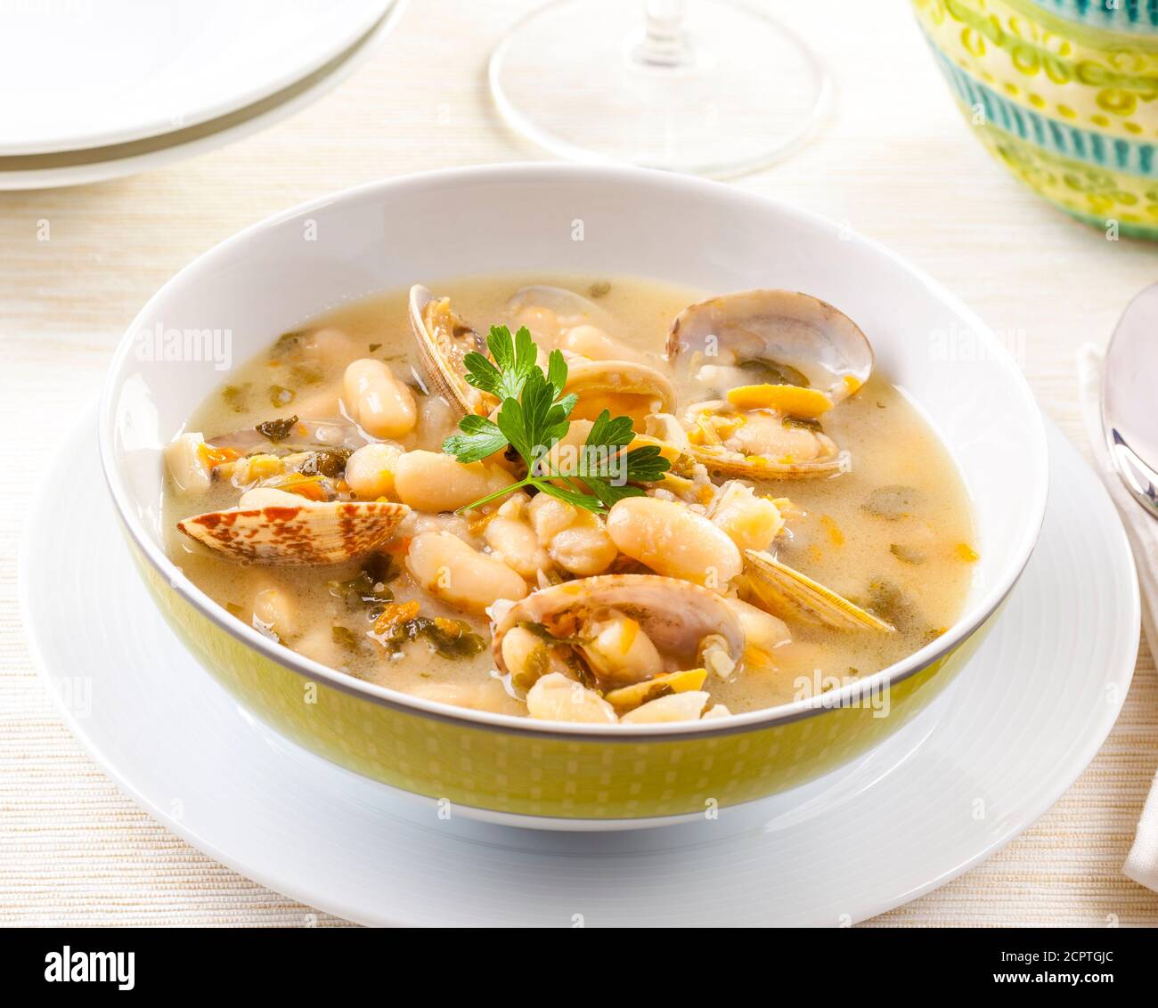 Seafood chowder served with beans Stock Photo Alamy