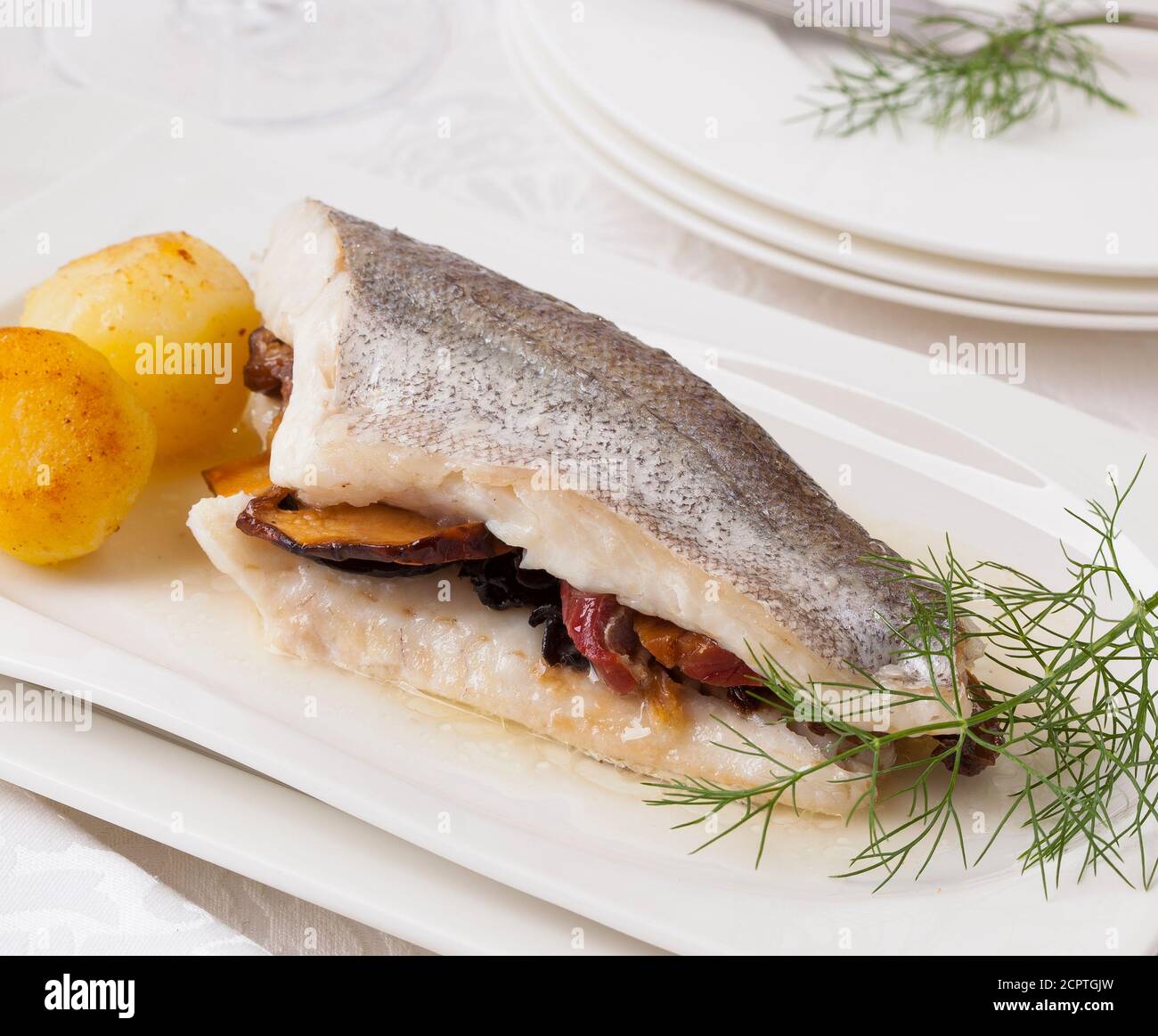 Fish fillet stuffed with vegetables. Stock Photo