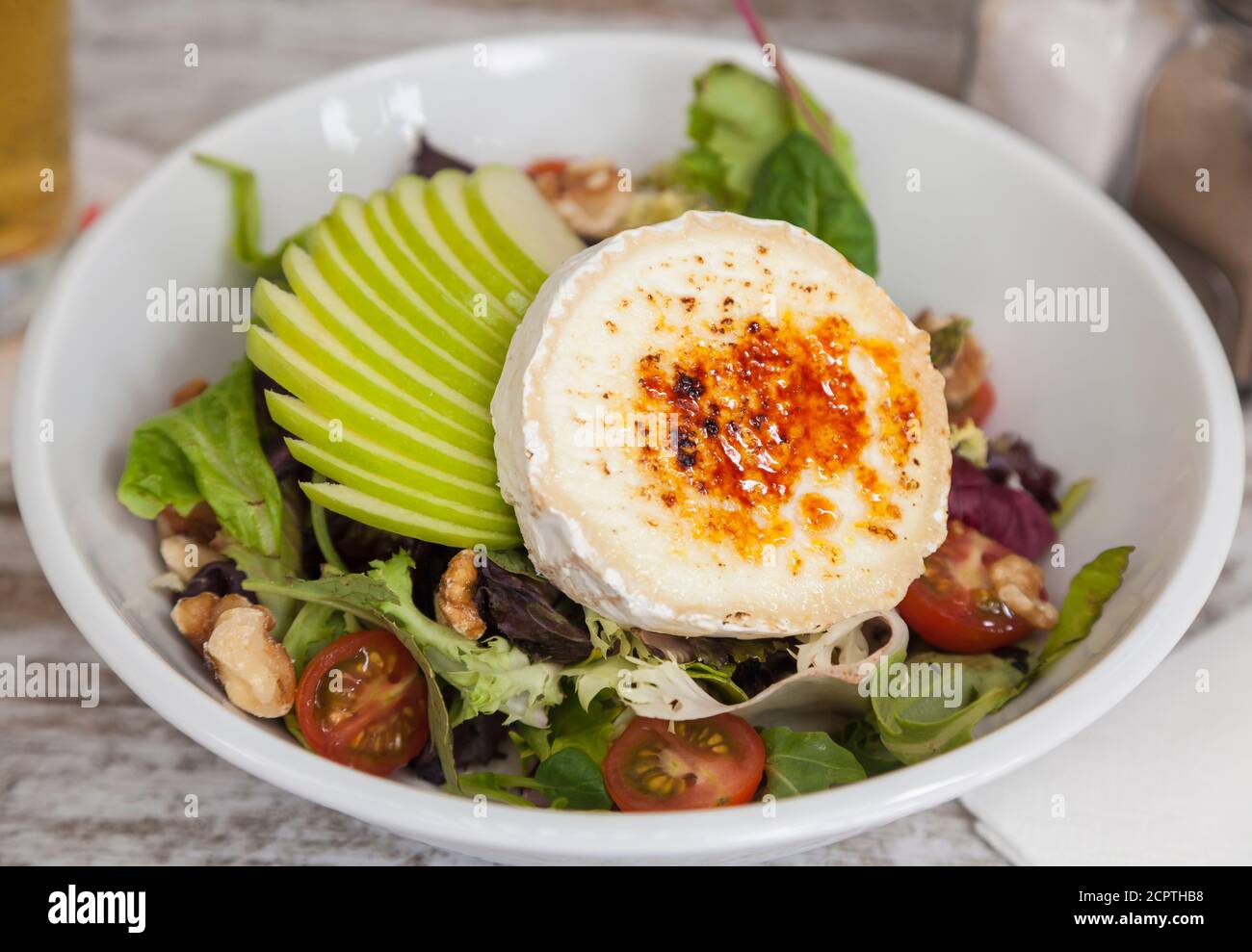 Healthy salad with fresh apple and goat cheese Stock Photo