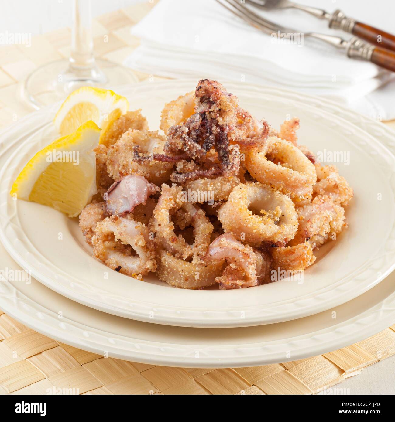 Fried calamari rings are a favorite Greek meze that is served in every fish tavern. Stock Photo