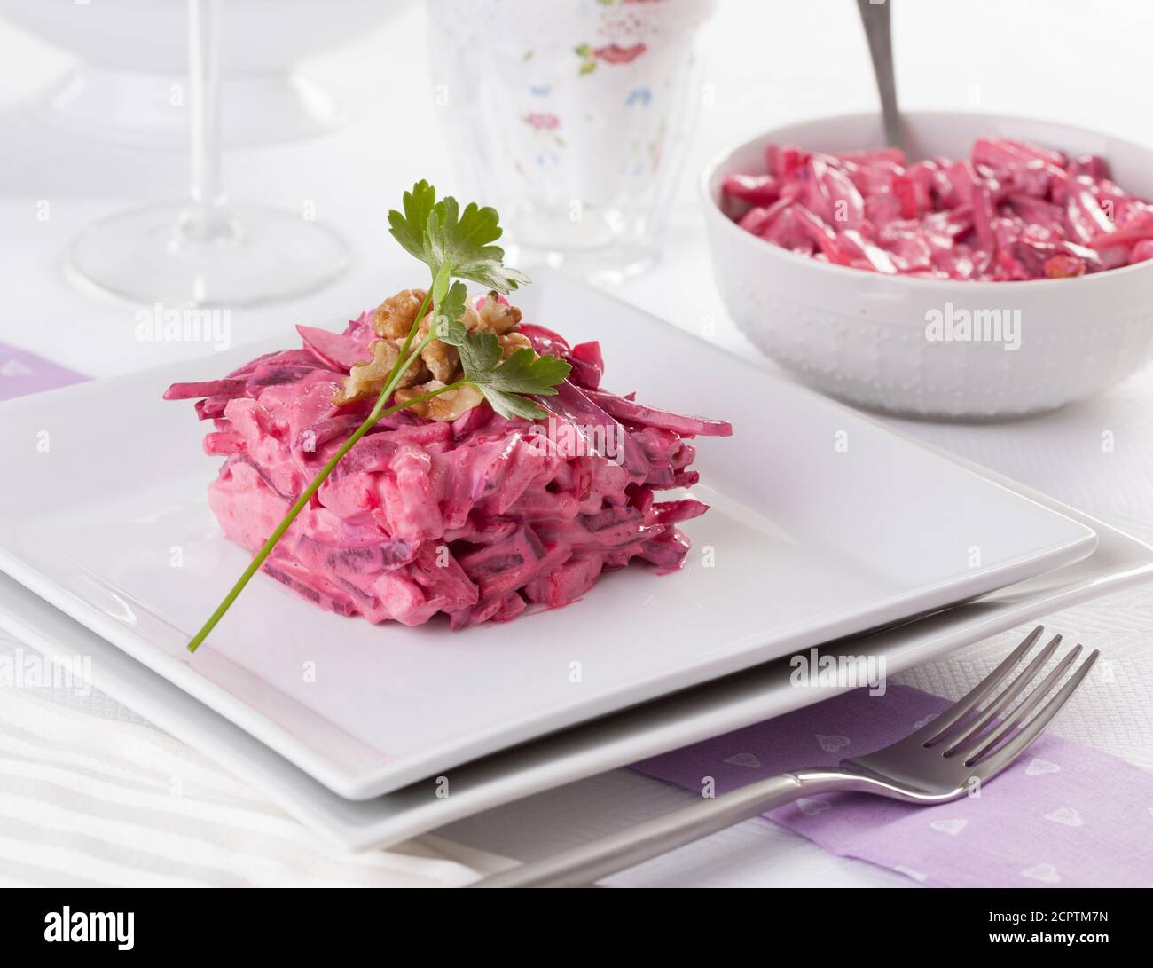 Beetroot salad served with walnuts and parsley. Stock Photo