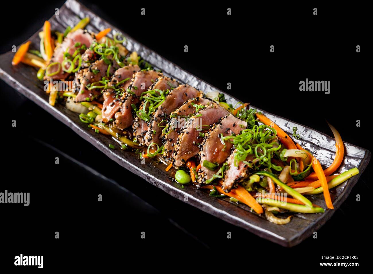 Japanese food. Tuna tataki. Seared tuna with sesame seeds and soy sauce