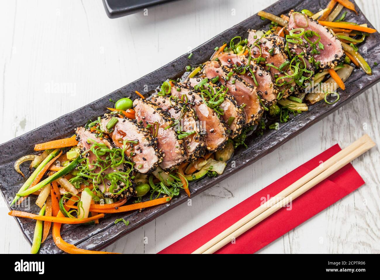 Japanese food. Tuna tataki. Seared tuna with sesame seeds and soy sauce