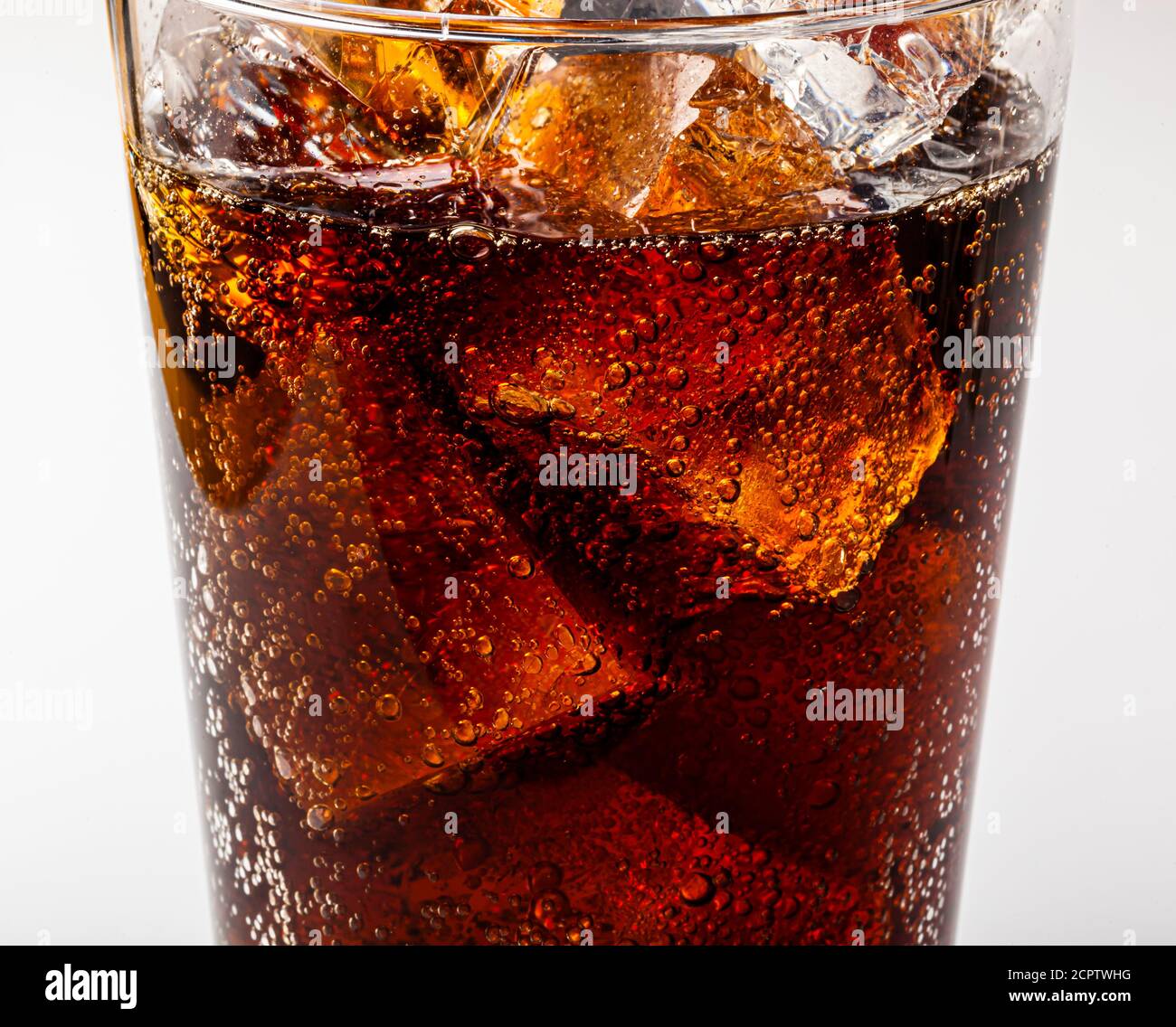 Ice cold refreshing carbonated summer drink with ice chunks in a glass. Stock Photo
