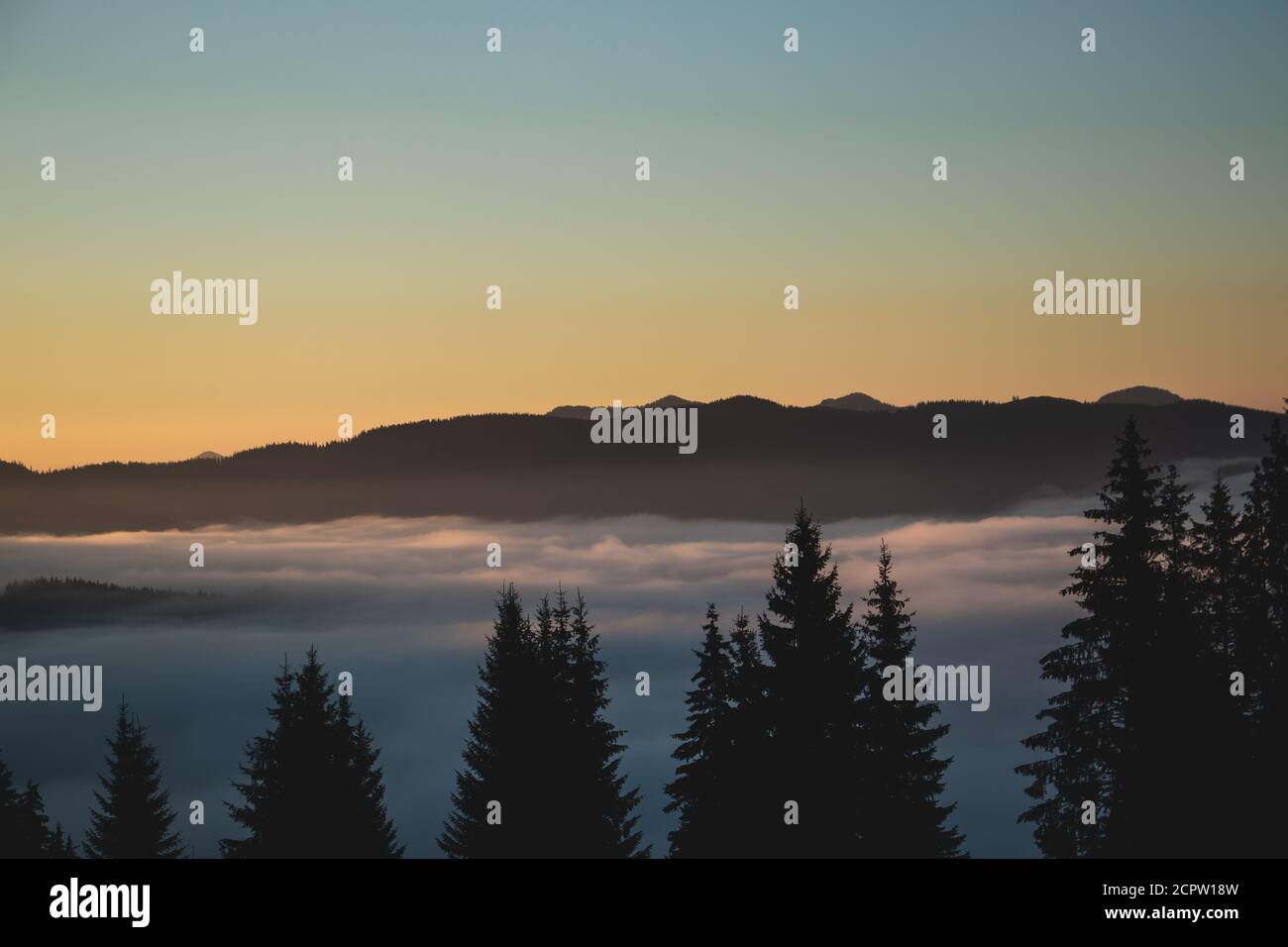 Over the clouds view, mountains in the background, sun rising time ...