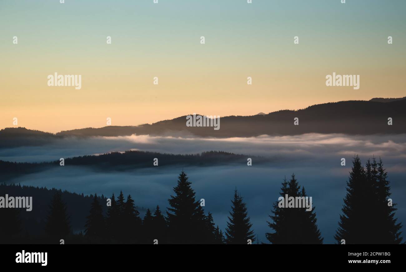 Over the clouds view, mountains in the background, sun rising time ...