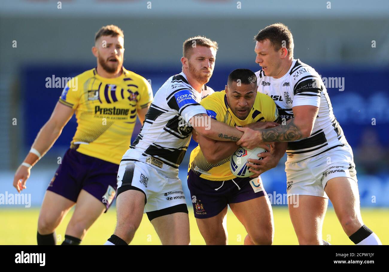 Hull's Marc Sneyd (second left) and Jordan Lane (right) tackle Wigan's Willie Isa during the Betfred Super League match at the AJ Bell Stadium, Salford. Stock Photo
