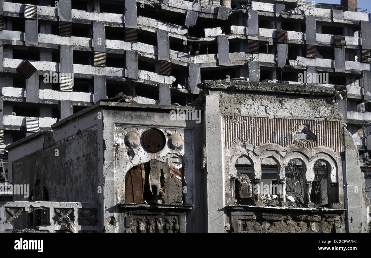10th December 1995 During the war in Bosnia: detail of battle-scarred buildings on Mostarskog bataljona Street, on the east side of the river in Mostar. Stock Photo
