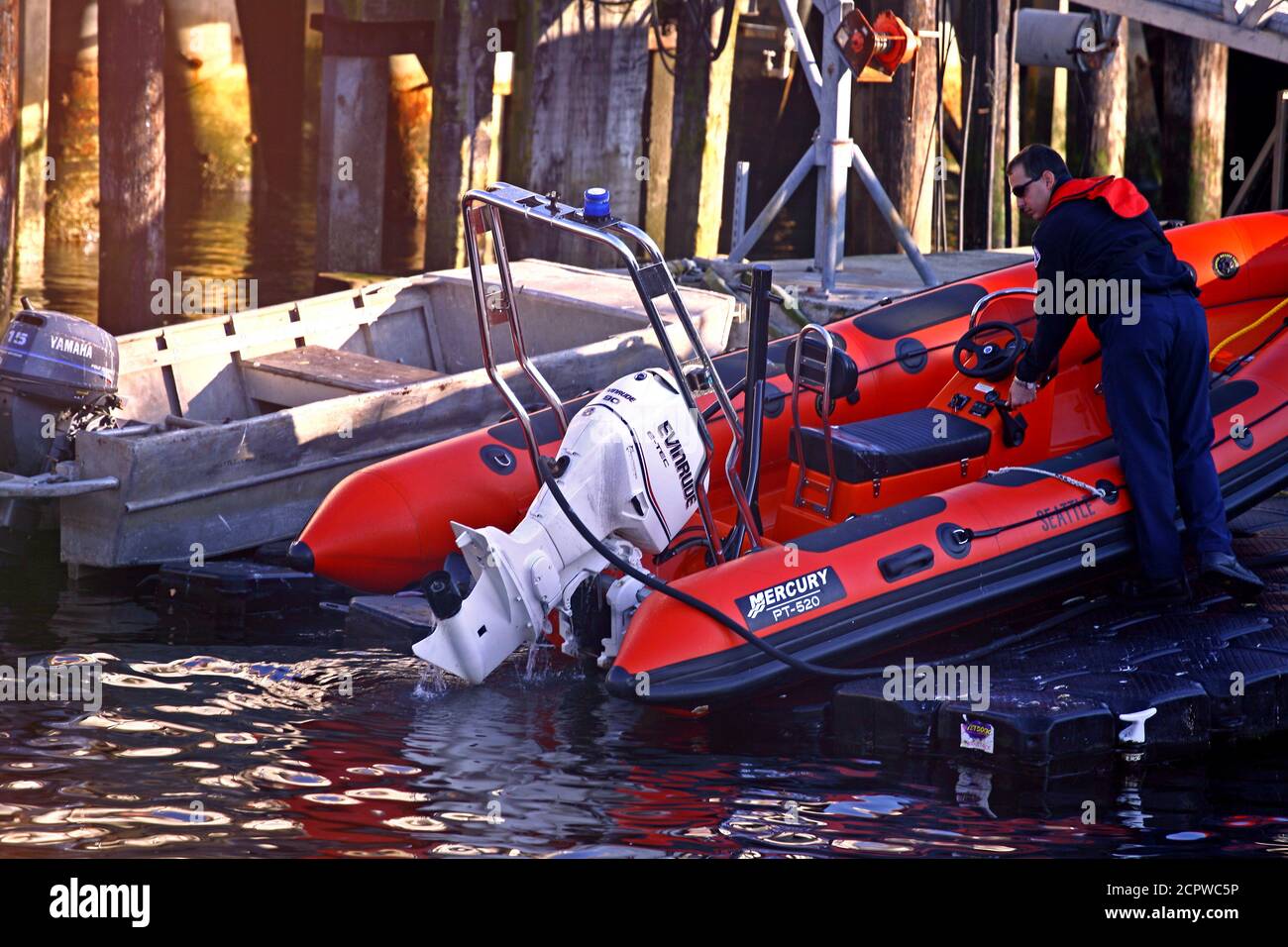 The Seattle Fire Department has water craft for fighting fires. Pictured is a small watercraft being checked to ensure it is ready for use if needed. Stock Photo