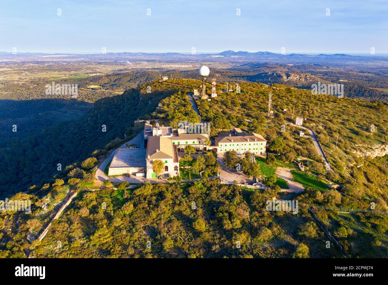 Santuari de Nostra Senyora de Cura monastery and antenna systems on the Puig de Randa mountain, Pla de Mallorca region, drone image, Mallorca, Stock Photo