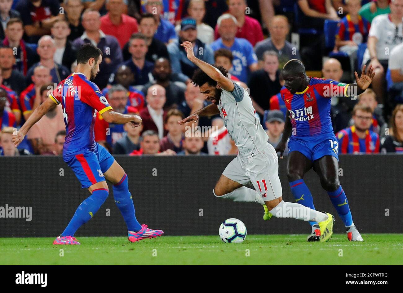 Soccer Football - Premier League - Crystal Palace v Liverpool - Selhurst Park, London, Britain - August 20, 2018  Crystal Palace's Mamadou Sakho concedes a penalty against Liverpool's Mohamed Salah                    REUTERS/Eddie Keogh  EDITORIAL USE ONLY. No use with unauthorized audio, video, data, fixture lists, club/league logos or 'live' services. Online in-match use limited to 75 images, no video emulation. No use in betting, games or single club/league/player publications.  Please contact your account representative for further details. Stock Photo