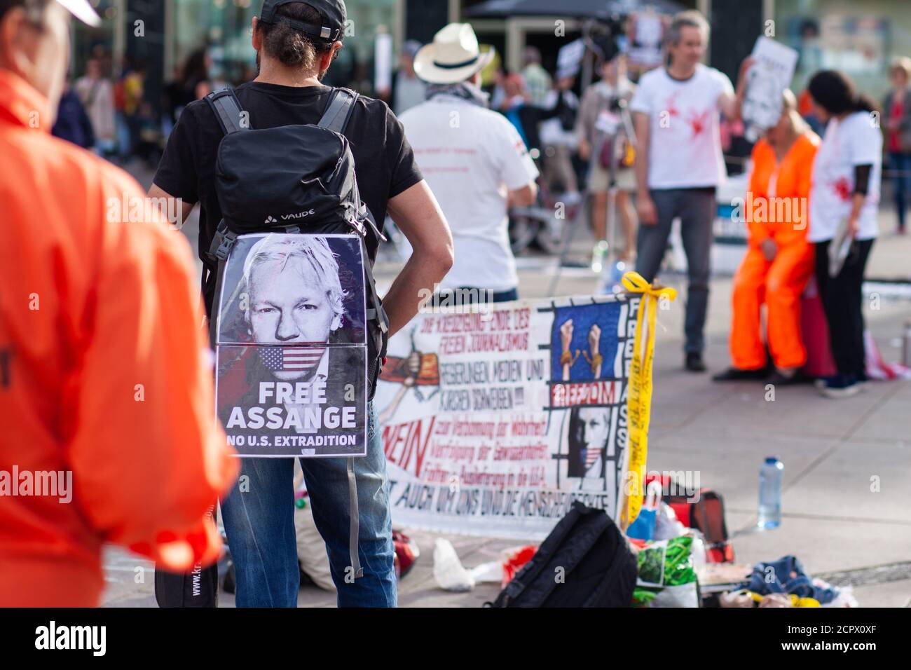 BERLIN - September 19: People demonstrate against the extradition of publisher Julian Assange to the United States, at a protest on 19 Sep 2020 in Berlin. Assange is wanted by the US government for distributing military documents that showed evidence of war crimes, and faces extradition from the UK to the US. Stock Photo