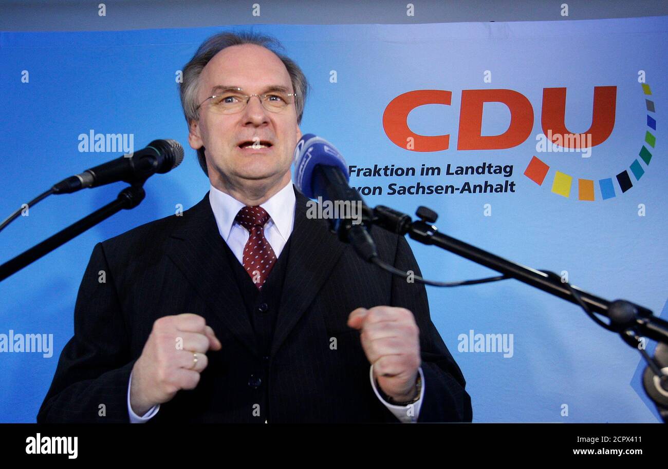 Reiner Haseloff, candidate of the Christian Democratic Union (CDU) in the Saxony-Anhalt state election gives a TV interview in Magdeburg March 20, 2011. German Chancellor Angela Merkel began an electoral stress test on Sunday, with the first of three state polls when she may suffer a major setback despite a nuclear policy U-turn and military opt-out in Libya.       REUTERS/Thomas Peter (GERMANY  - Tags: POLITICS ELECTIONS POLITICS) Stock Photo