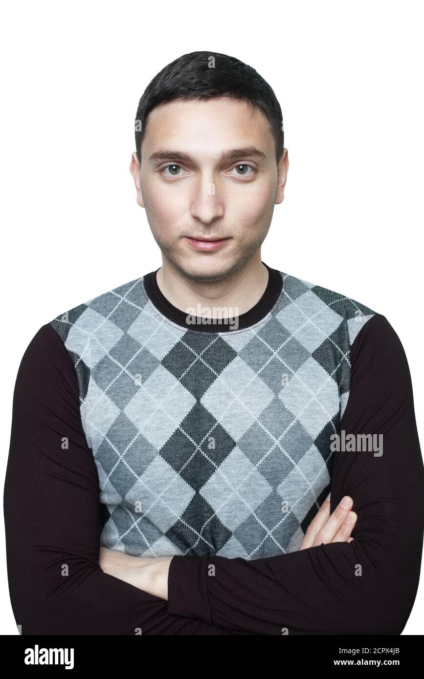 Young man in black checkered sweater with crossed arms isolated on white Stock Photo