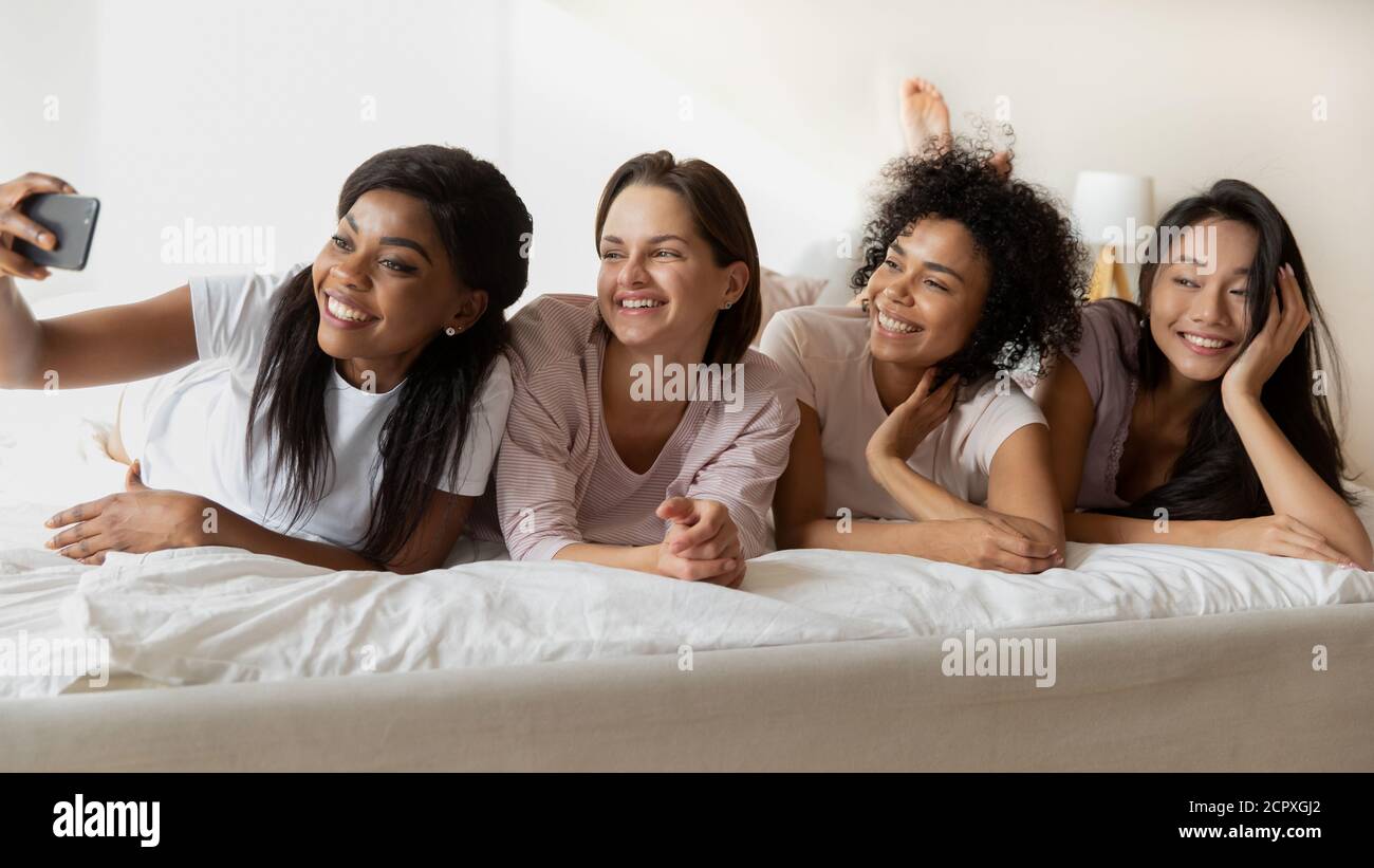 Young african american girl taking selfie with multiracial friends. Stock Photo