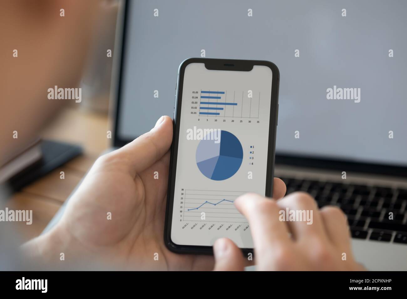Close up of man using modern cellphone analyzing finances Stock Photo