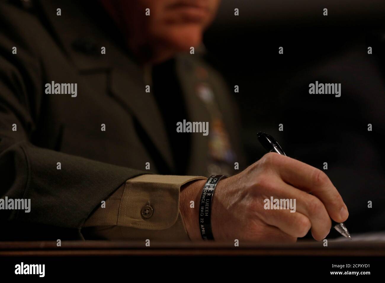 Commandant of the Marine Corps Gen. Robert Neller takes notes during a Senate Armed Services Committee hearing on the Marines United Facebook page on Capitol Hill in Washington, D.C., U.S. March 14, 2017.  REUTERS/Aaron P. Bernstein Stock Photo
