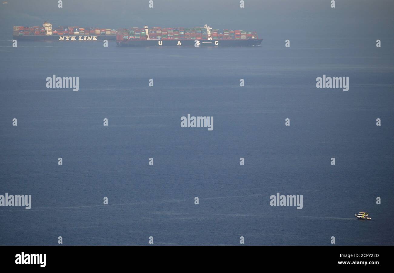Shipping containers travelling on the Nippon Yusen (NYK LINE) and United Arab Shipping Company (UASC), cross the Gulf of Suez towards the Red Sea before entering the Suez Canal, in El Ain El Sokhna in Suez, east of Cairo, Egypt April 24, 2017. Picture taken April 24, 2017. REUTERS/Amr Abdallah Dalsh Stock Photo