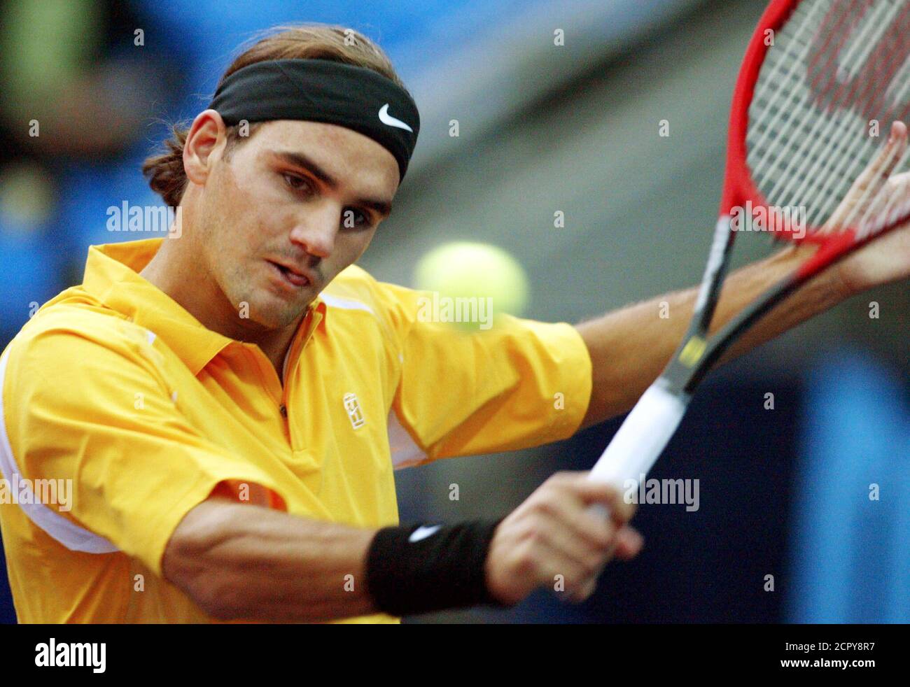 Roger Federer of Switzerland returns the ball to Russia's Denis Golovanov  during their Kremlin Cup tennis match in Moscow October 2, 2002. Federer  won the match 6-0 6-1. REUTERS/Grigory Dukor GD/CLH Stock