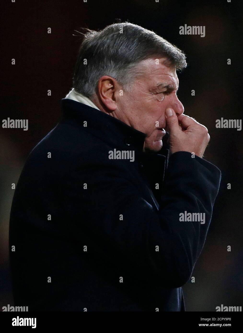 West Ham United's manager Sam Allardyce reacts during their English League Cup semi-final second leg soccer match against Manchester City at Boleyn Ground in London January 21, 2014.   REUTERS/Stefan Wermuth (BRITAIN - Tags: SPORT SOCCER) Stock Photo