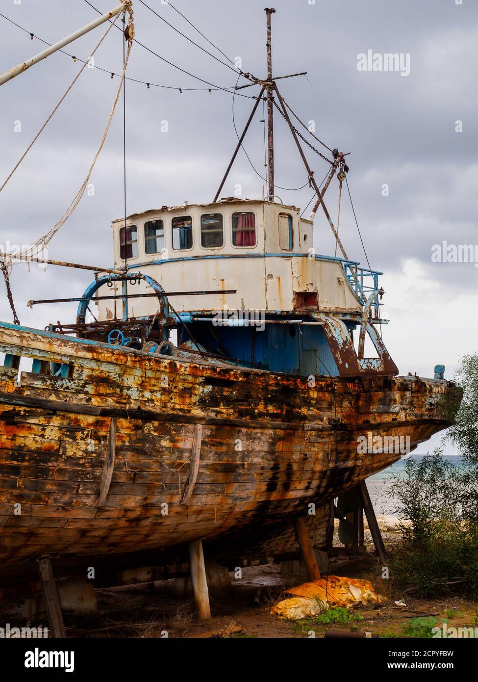 Abandoned old fishing boat in Latchi Harbour, Cyprus Stock Photo - Alamy
