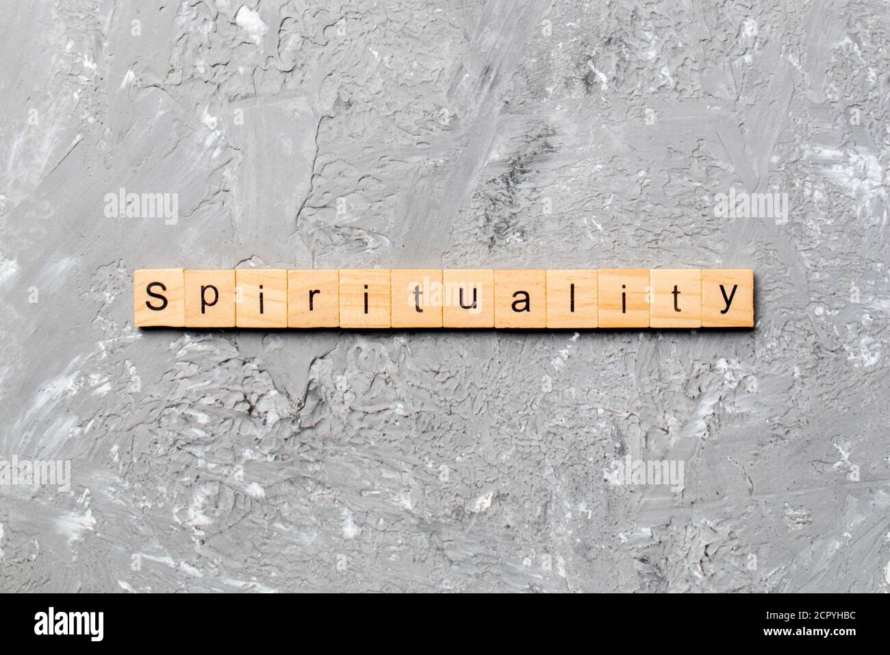 Spirituality word written on wood block. Spirituality text on table