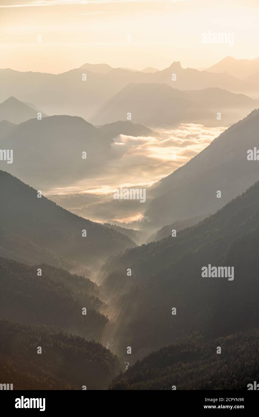 Valley in the mountains with morning fog Stock Photo - Alamy