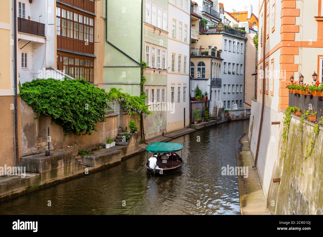 The architecture of the strago city of Prague. River channel in the ...
