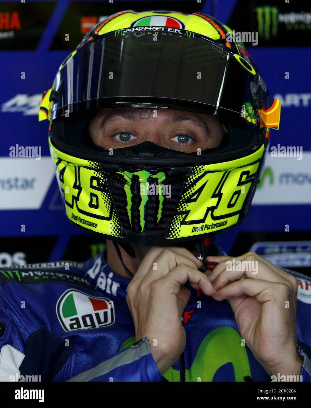 Dekan grænse Nyttig Yamaha MotoGP rider Valentino Rossi of Italy puts his helmet on in his box  before the start the first free practice session of the Aragon Motorcycling  Grand Prix at Motorland race track