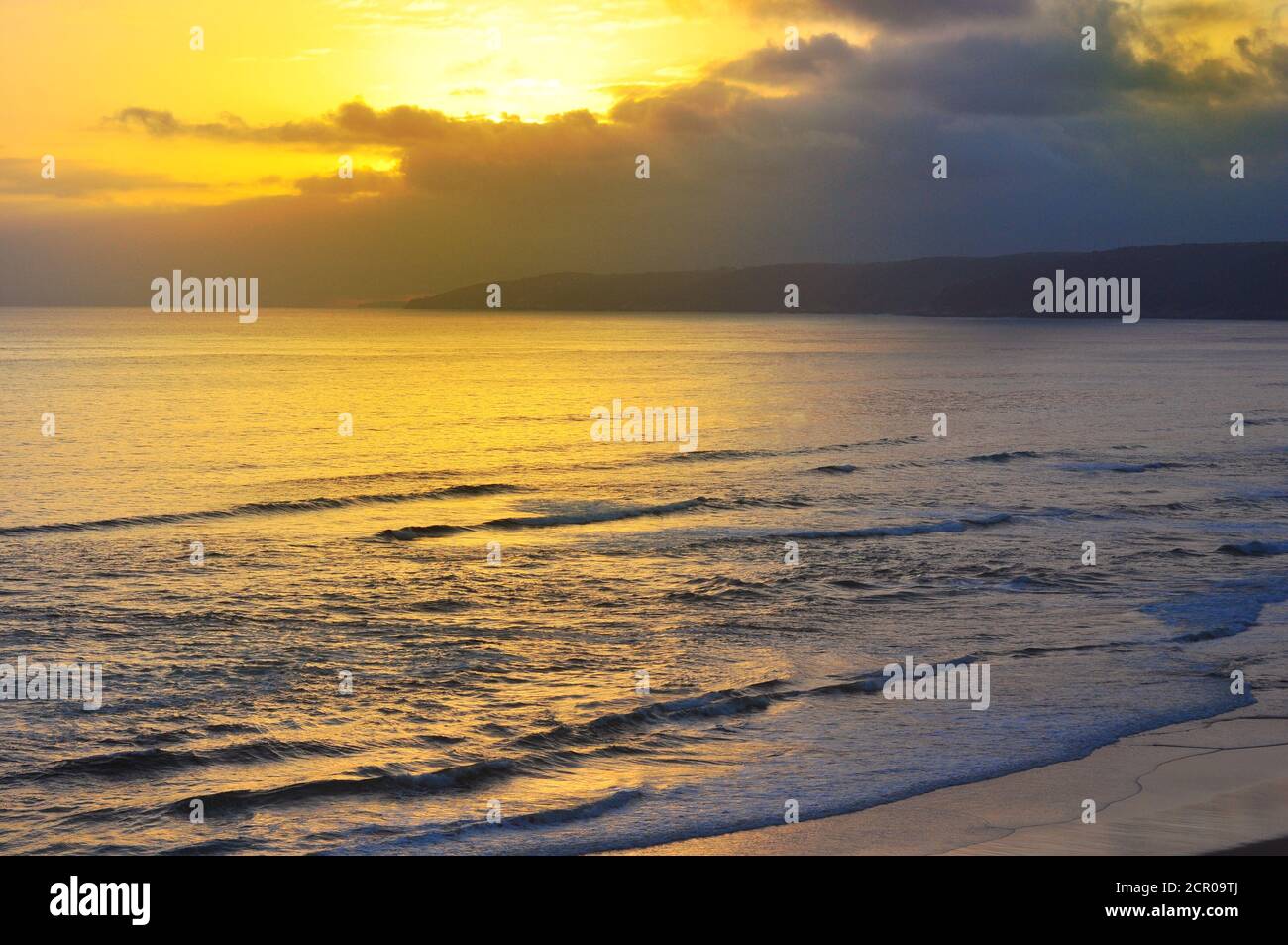 Sandy beach at sunset Stock Photo - Alamy
