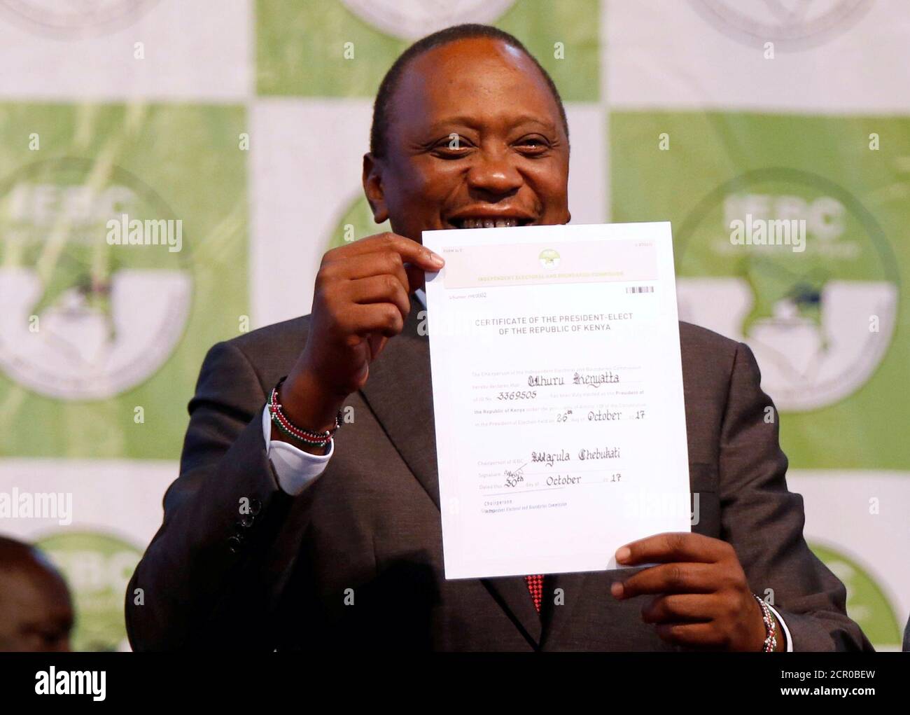 Incumbent President Uhuru Kenyatta holds the certificate of President-Elect of the Republic of Kenya after he was announced winner of the repeat presidential election at the IEBC National Tallying centre at the Bomas of Kenya, in Nairobi, Kenya October 30, 2017. REUTERS/Thomas Mukoya TPX IMAGES OF THE DAY Stock Photo