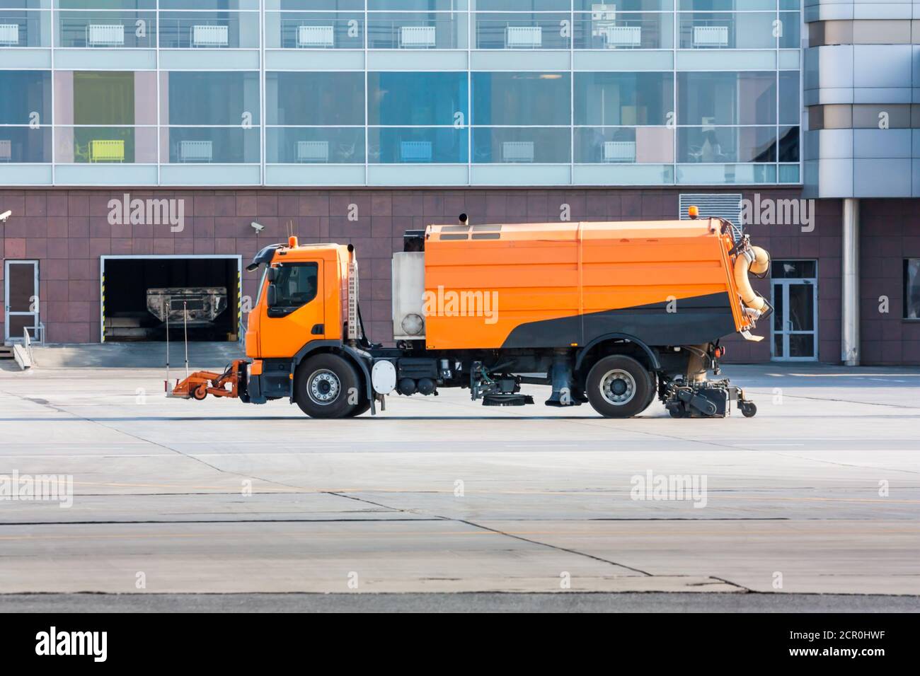 Vacuum sweeper near the airport terminal Stock Photo Alamy