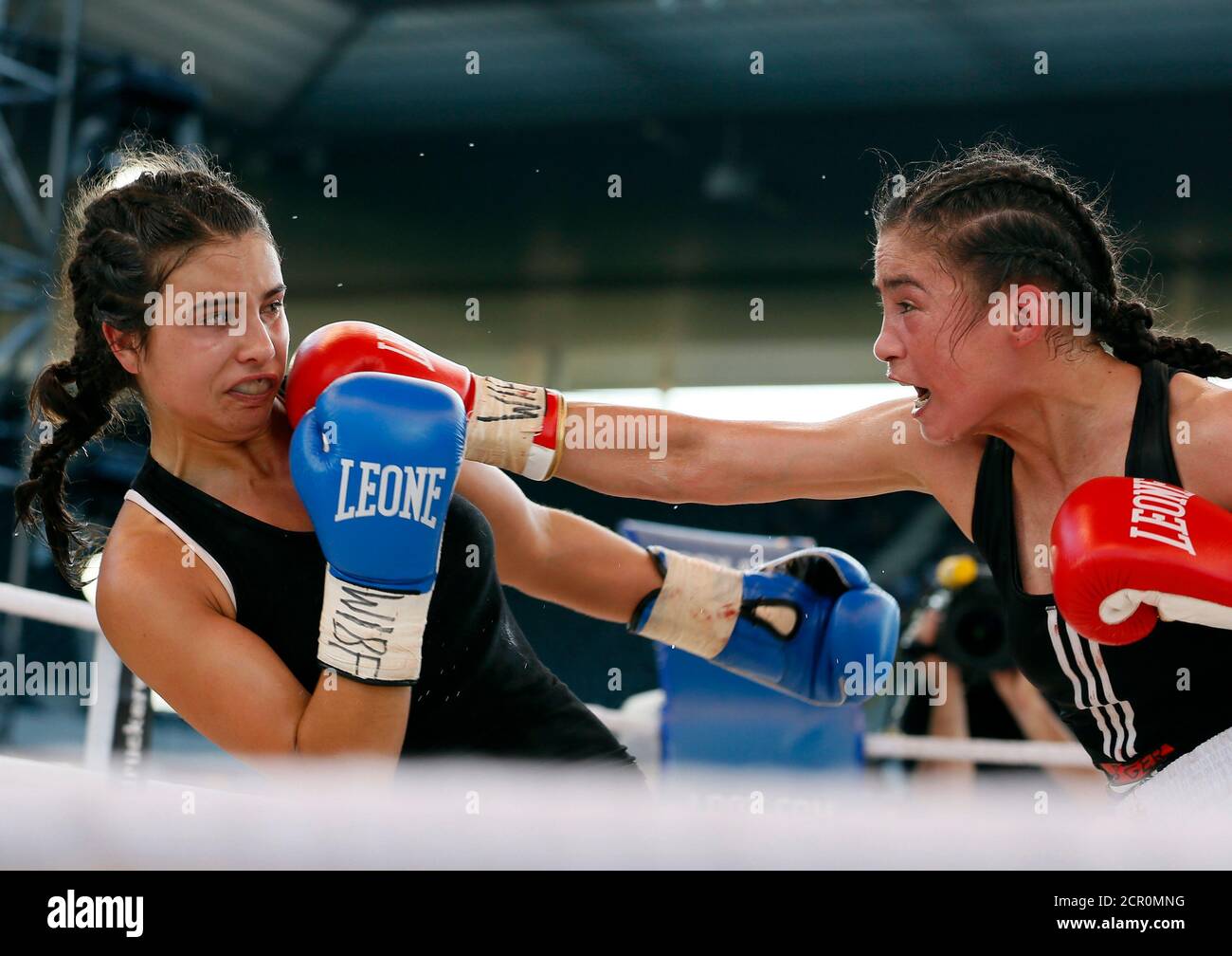Aniya Seki of Switzerland (R) punches Eva Marcu of Hungary during their  Women Super Flyweight bout