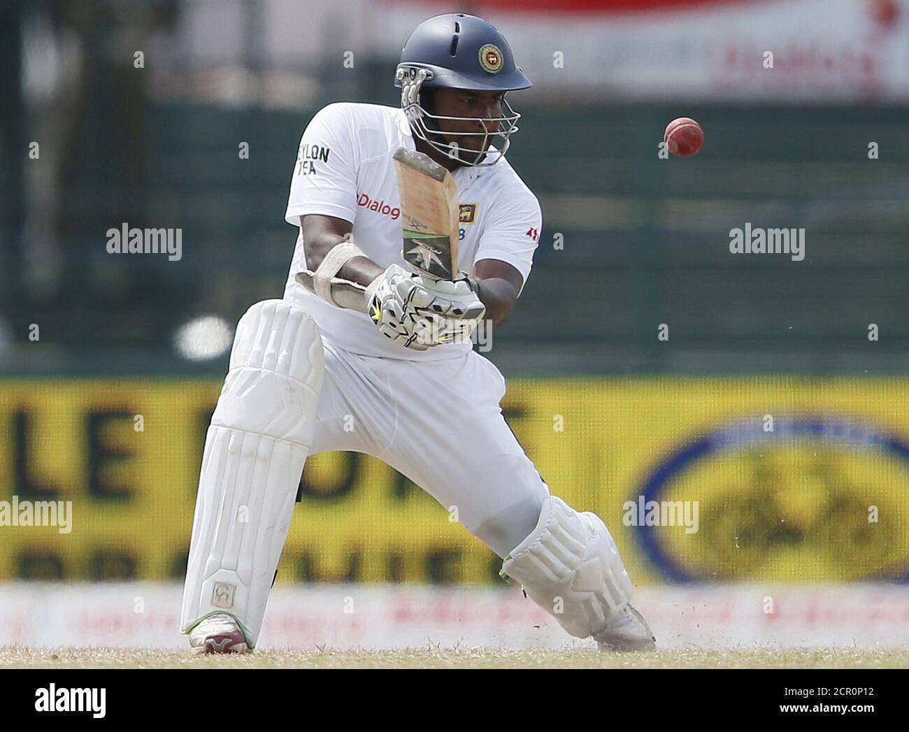 Sri Lanka's Rangana Herath hits a boundary during the third day of their third and final test cricket match against India in Colombo , August 30, 2015. REUTERS/Dinuka Liyanawatte Stock Photo