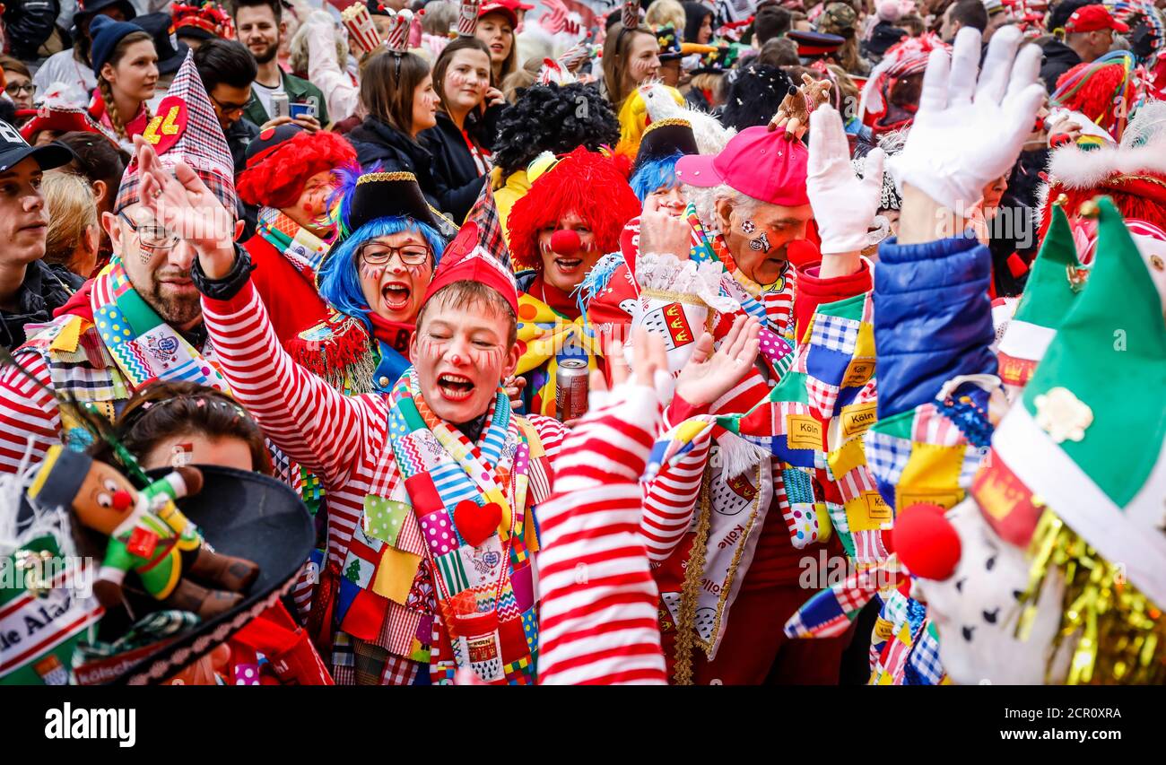 Colorfully costumed carnivalists celebrate Carnival in Cologne, on Weiberfastnacht the street carnival traditionally opens on the Alter Markt, which t Stock Photo