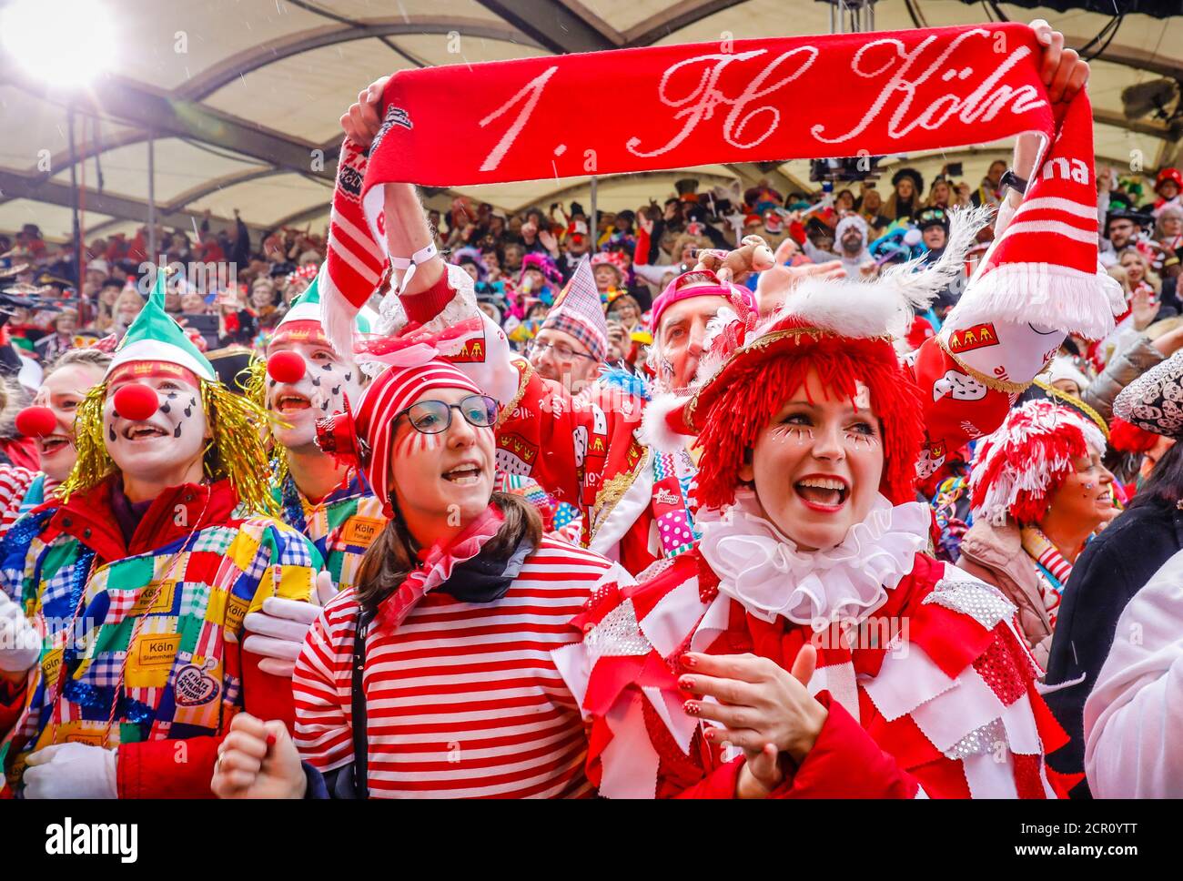 Colorfully costumed carnivalists celebrate Carnival in Cologne, on Weiberfastnacht the street carnival traditionally opens on the Alter Markt, which Stock Photo