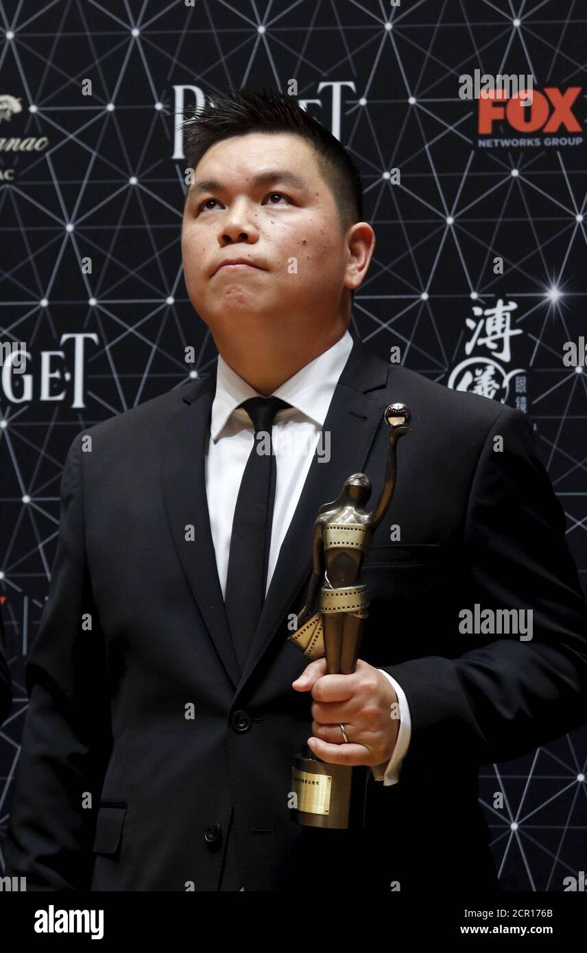 Executive producer Andrew Choi reacts backstage after receiving a trophy for his movie 'Ten Years” which won the Best Film award at the Hong Kong Film Awards in Hong Kong, China April 3, 2016.   REUTERS/Bobby Yip Stock Photo