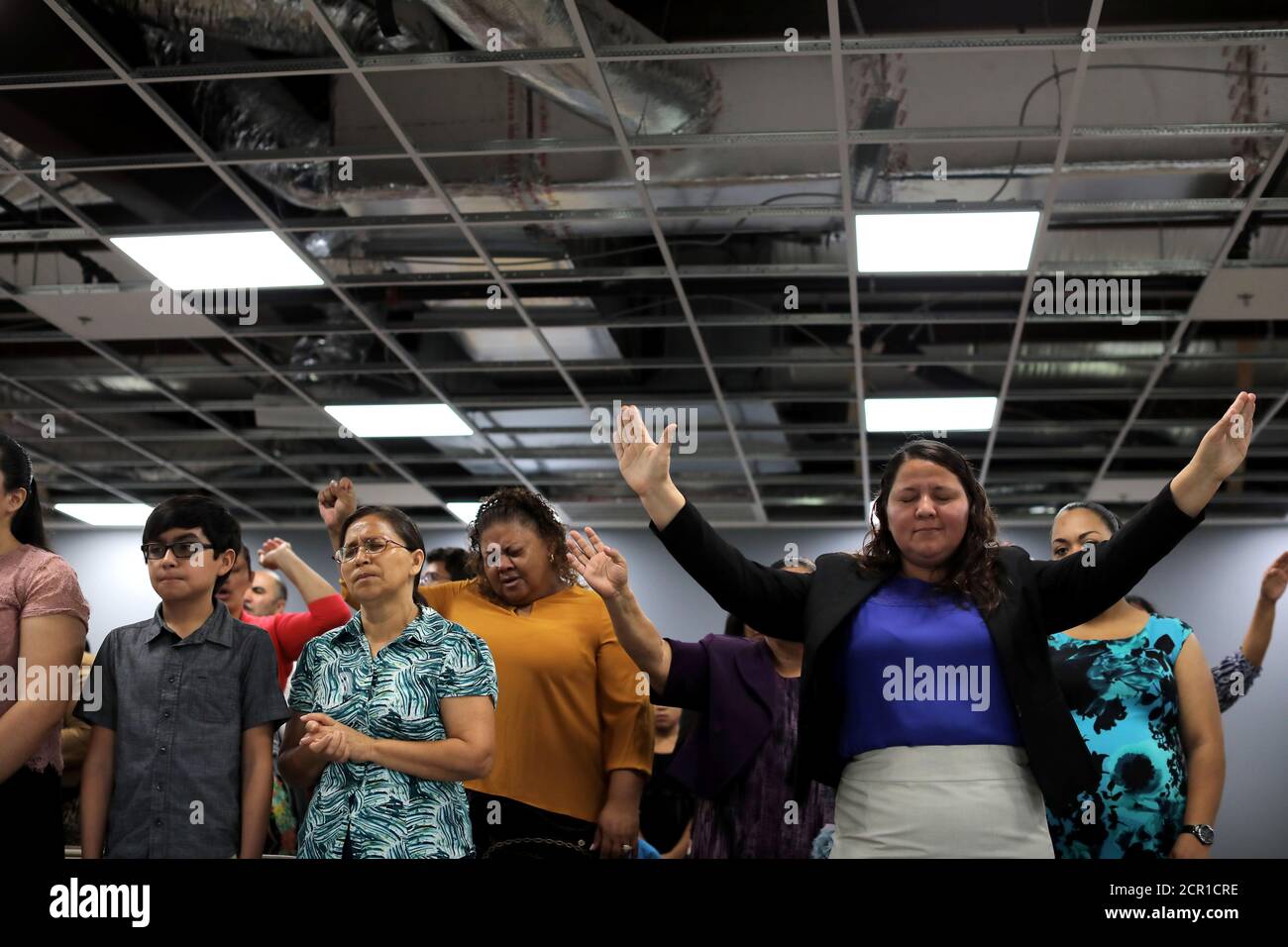 Local residents take part in the first church service after Tropical Storm Harvey at the Iglesia de Dios Pentecostal . El Triunfo church in east Houston, Texas, ., September 3, 2017. REUTERS/Carlos Local residents take part in the first church service after Tropical Storm Harvey at the Iglesia de Dios Pentecostal . El Triunfo church in east Houston, Texas, ., September 3, 2017. REUTERS/Carlos
