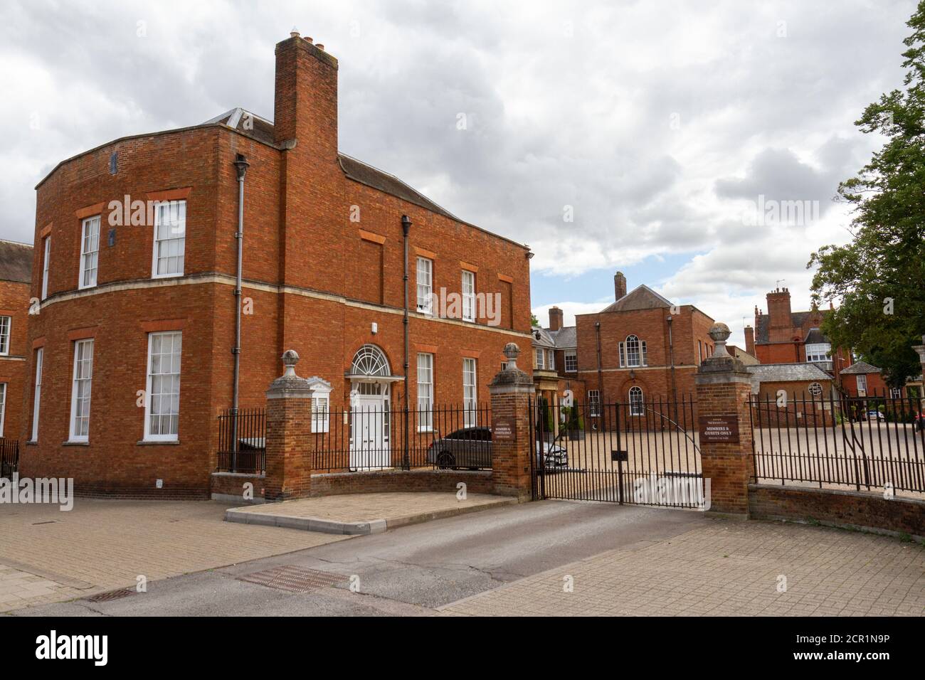 Main gated entrance to The Jockey Club headquarters on High Street, Newmarket, Suffolk, UK. Stock Photo