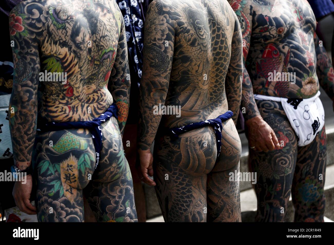 Men show their traditional full body tattoos as they pose outside the Sensoji temple during the Sanja Matsuri festival in the Asakusa district of Tokyo May 17, 2015. The Sanja Matsuri festival Men show their traditional full body tattoos as they pose outside the Sensoji temple during the Sanja Matsuri festival in the Asakusa district of Tokyo May 17, 2015. The Sanja Matsuri festival