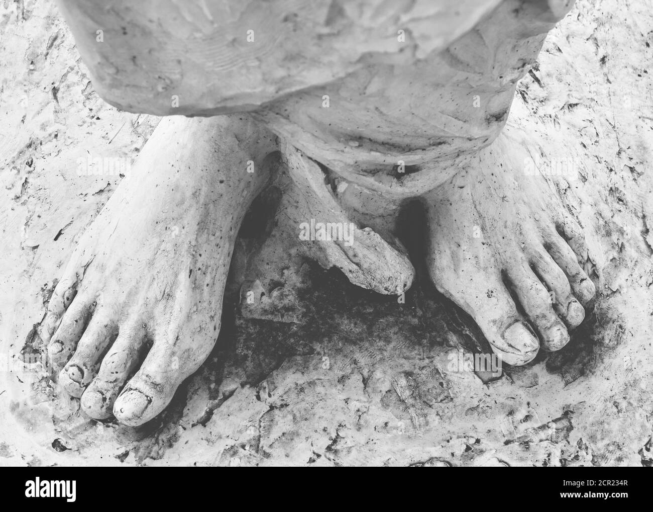 Feet of Christ. Close-up of the feet of Jesus Christ. Top view. Shallow DOF. Stock Photo