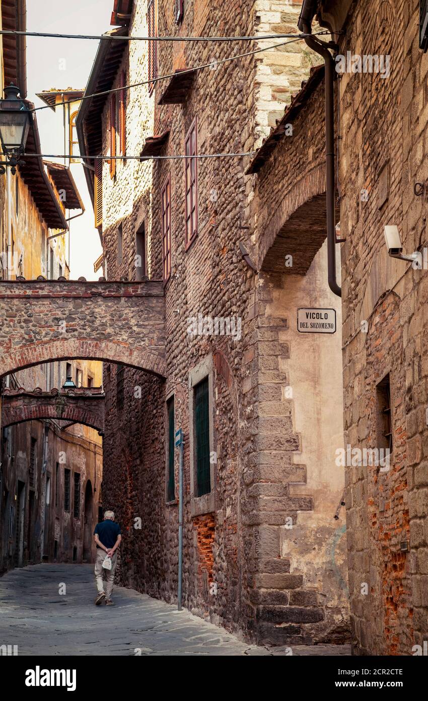 House, alley, man, Pistoia, Tuscany, Italy Stock Photo