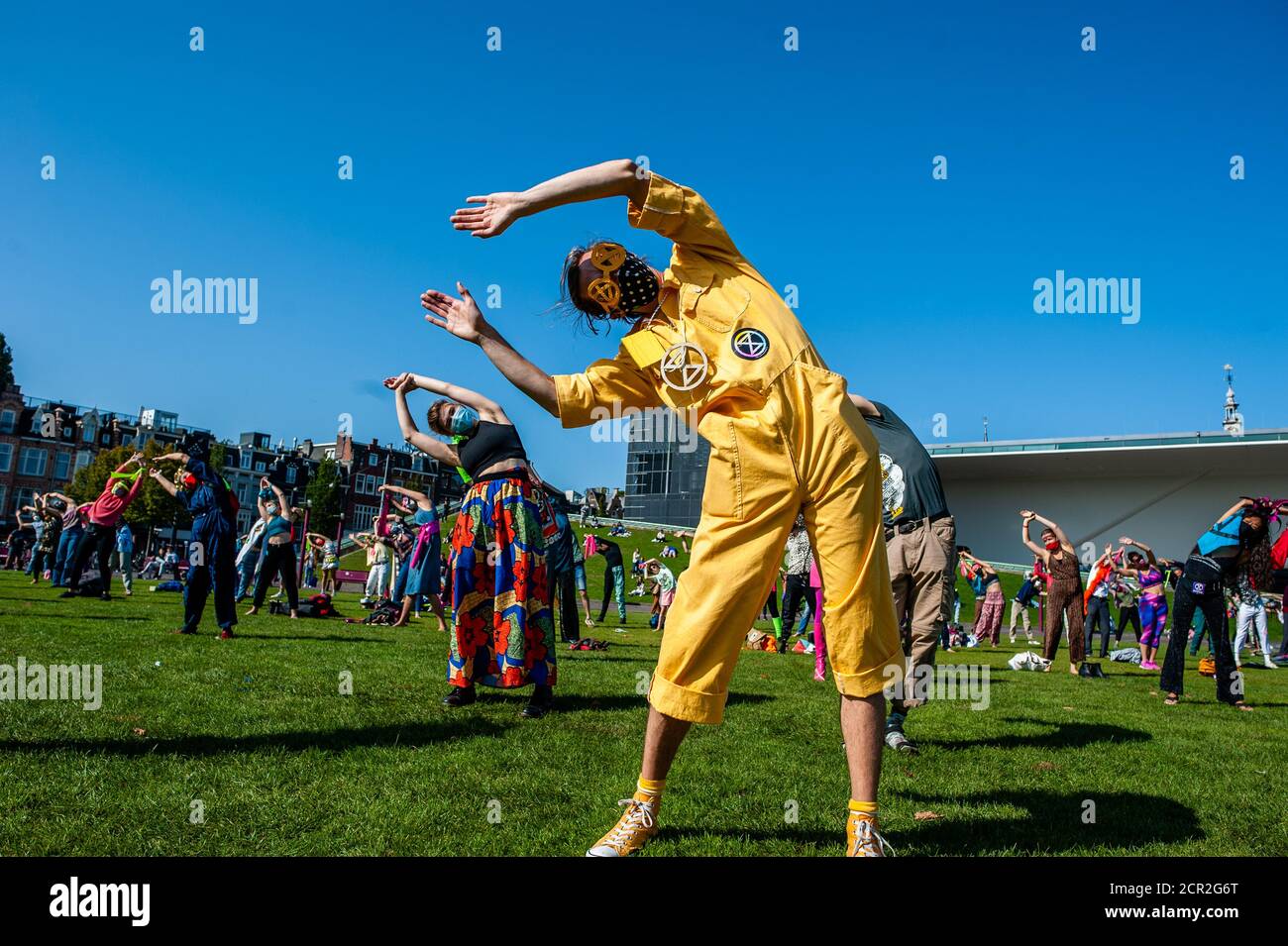 Activists are seen dancing while raising their hands during the rally ...