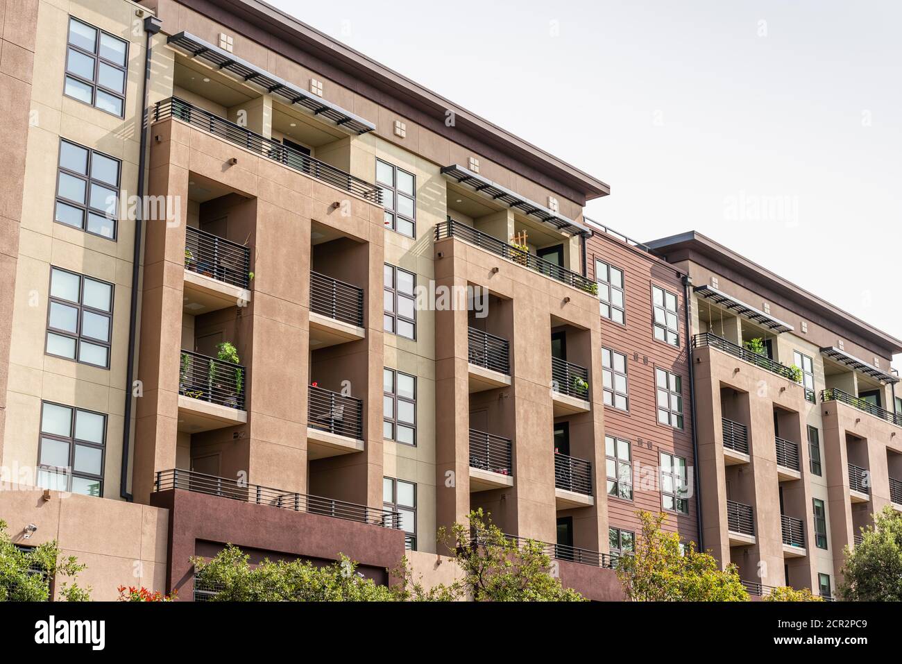 Exterior view of modern apartment building offering luxury rental units ...