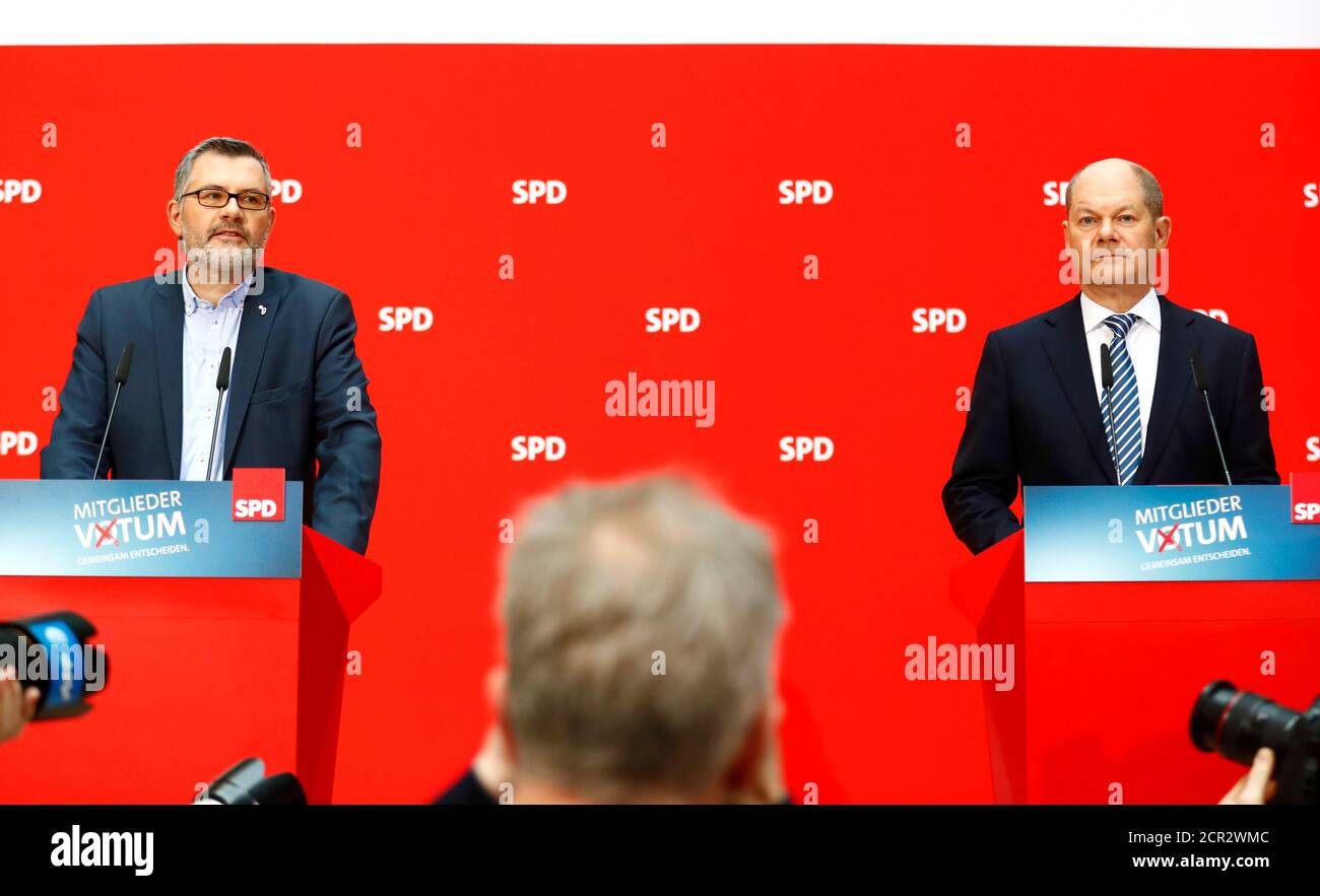Dietmar Nietan (L) and Olaf Scholz of Social Democratic Party (SPD) attend a news conference to announce the results of the voting for a possible coalition between the Social Democratic Party (SPD) and the Christian Democratic Union (CDU) in Berlin, Germany March 4, 2018. REUTERS/Hannibal Hanschke Stock Photo