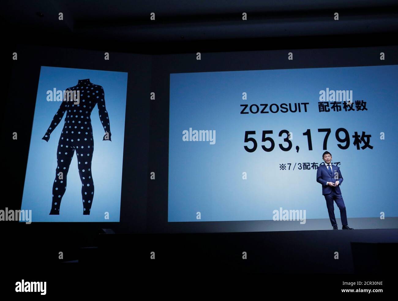 Yusaku Maezawa The Chief Executive Of Zozo Which Operates Japan S Popular Fashion Shopping Site Zozotown And Is Officially Called Start Today Co Speaks In Front Of A Projection About Zozosuit At An