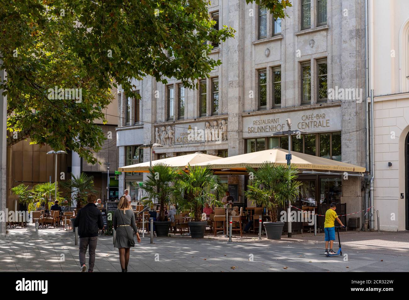 Old town in Hannover is full of small cafes and restaurants where people can enjoy their food and drinks. Sunny weekend day are good for that. Stock Photo