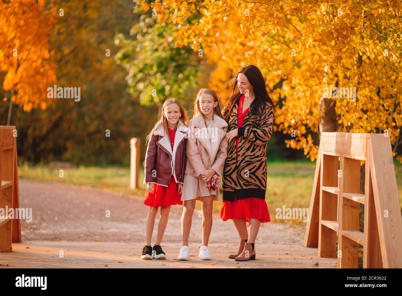 Little girl with mom outdoors in park at autumn day Stock Photo - Alamy